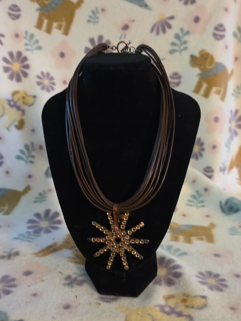 Multi-Strand Brown Necklace with Gold Starburst Pendant
